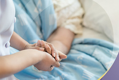 Close-up of nurse holding female patient's hand